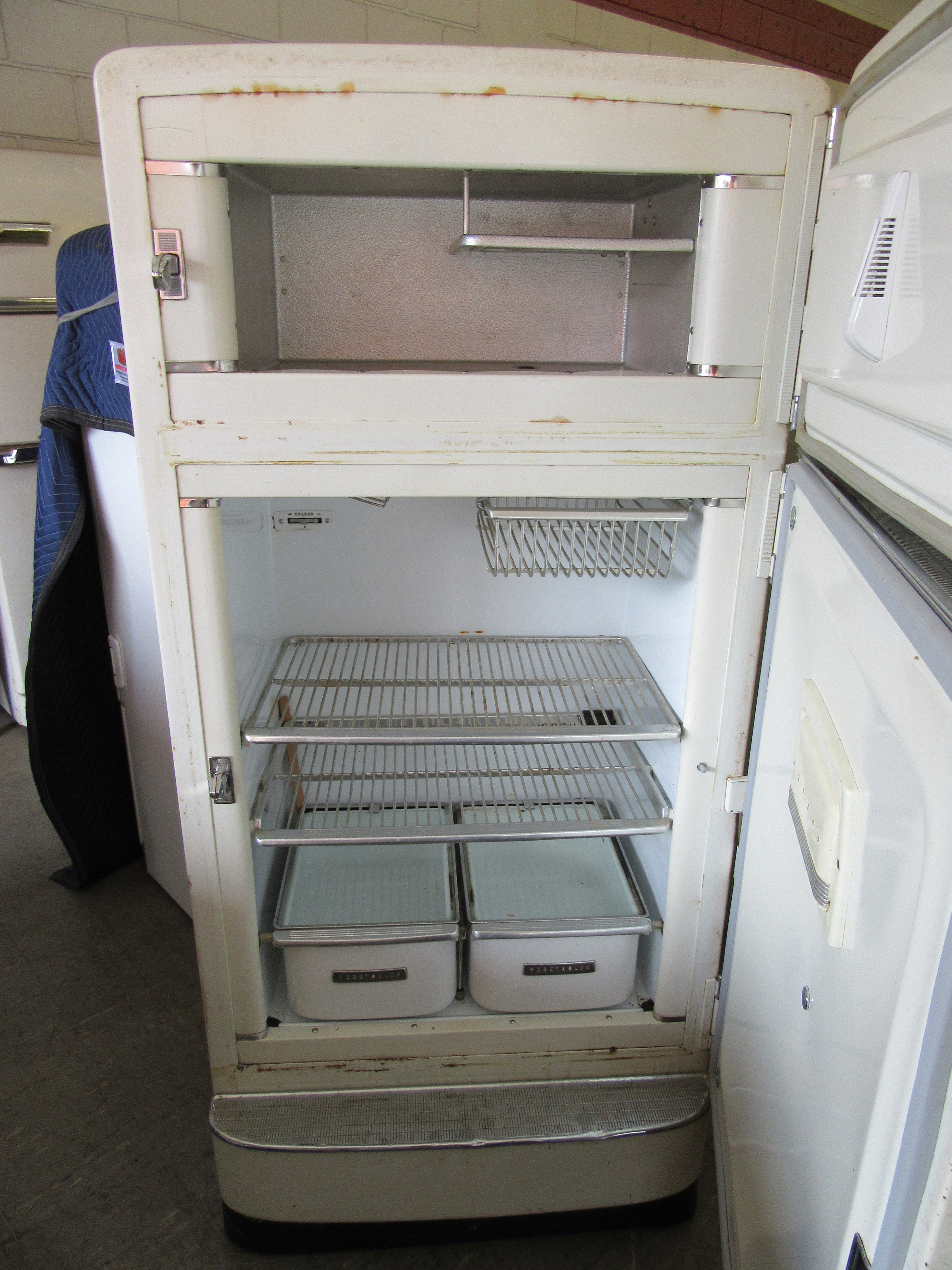 unrestored antique refrigerators